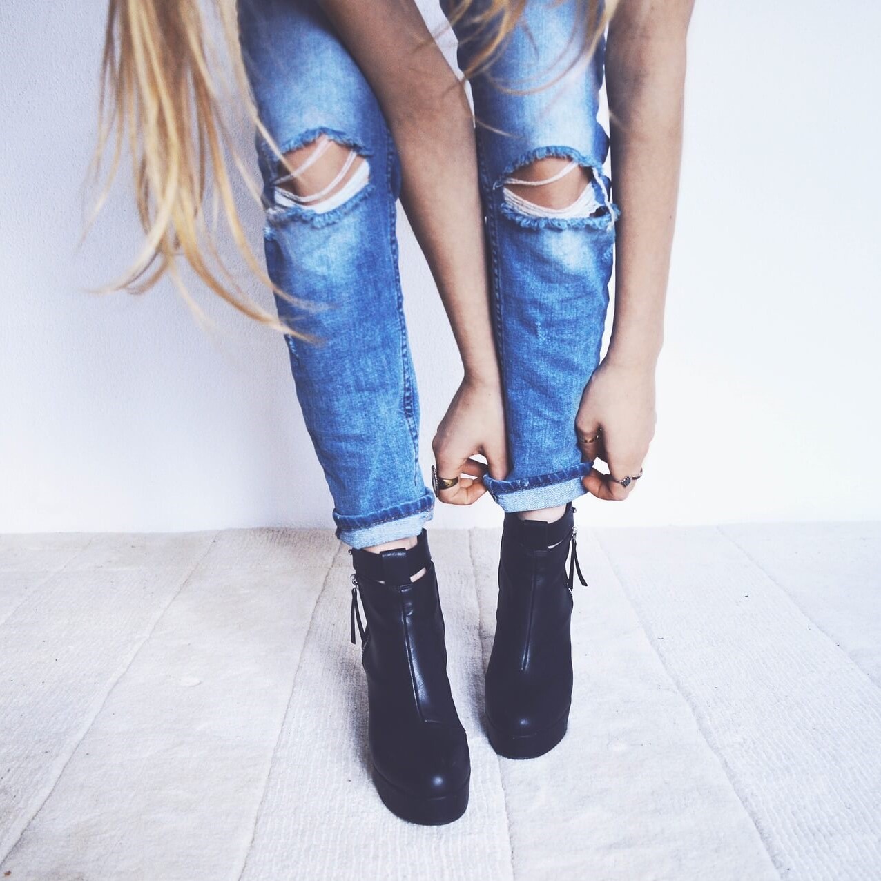 Women's black heeled boots in jeans